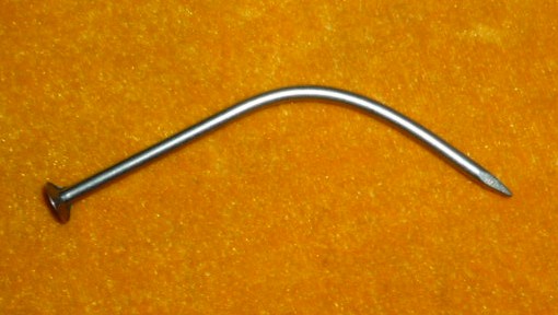 Centerfold of the Month - an Intriguing Photo of a Bent Nail