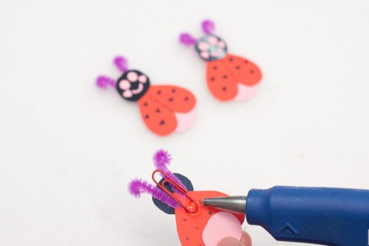 Glue your red paper clip to the back of your Love Bug.  Glue the clip at the base of the antenna.
