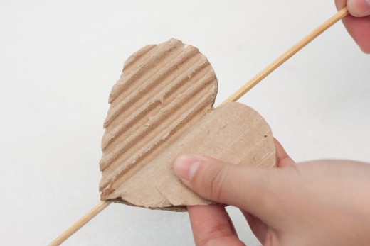 Split open your heart, peel into two pieces.  You are trying to get the bumpy edge on the corrugated cardboard so it will make a nice design on your homemade card