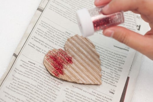 Sprinkle your red glitter all over the heart while the glue is wet