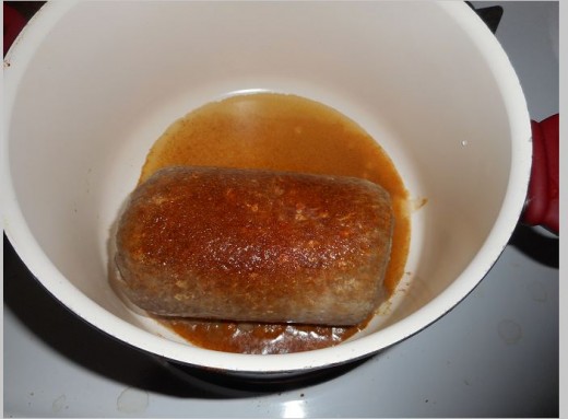 Put frozen hamburger in pan with a cup of water. Heat on medium low. Cover