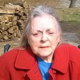 Still wearing her favorite, a red jacket.