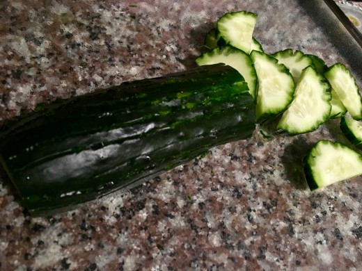 Score the cucumber with a fork to create scalloped edges.