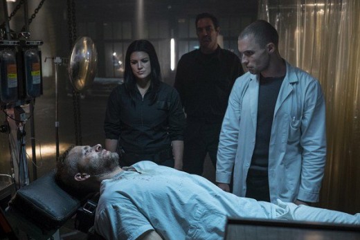 Angel Dust (played by Gina Carano of American Gladiator) and Ajax (played by Ed Skrien) overlooking Wade Wilson, pre-Deadpool.