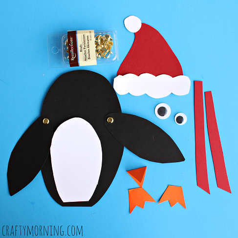 Cut up your penguin parts from the construction paper and then you put them all together.  You can also get some googly eyes.