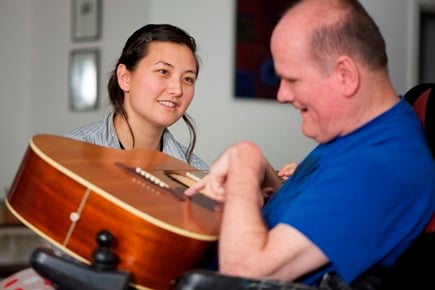 This particular clinician uses music  to improve a patient's health emotionally, physically and socially.