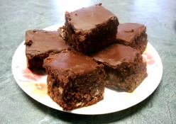 Rich Brownies Covered With Melted Chocolate Icing