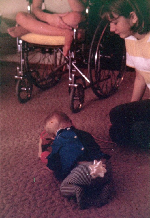 My sister Karen is in the wheelchair at the top.  Margie is to my right, and I'm the one with the bow on my butt. 