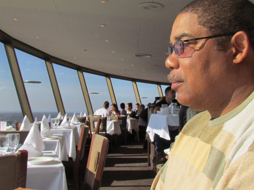 Walker, overlooks Niagara Falls, Ontario on the Canadian side in Skylon Restaurant, as it rotated showing a view of the city.