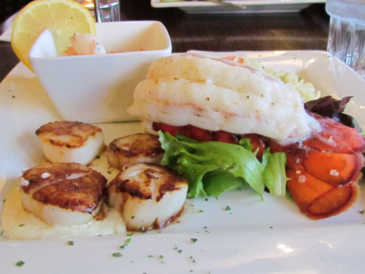 Pan Seared scallops, lobster tail, tiger shrimp and a medley of vegetables were served at the Red Coach Inn 