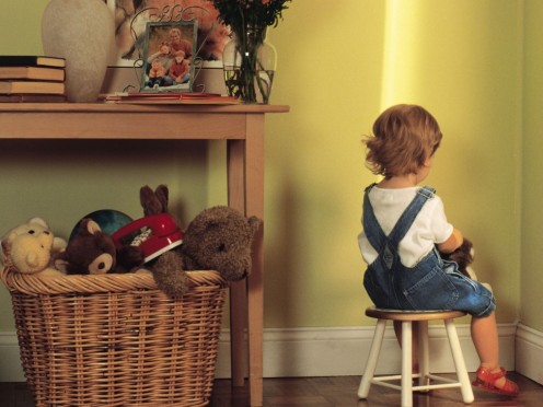 Having your child sit on a designated chair facing the wall is a good spot for time out since it reduces distraction and temptation for them.