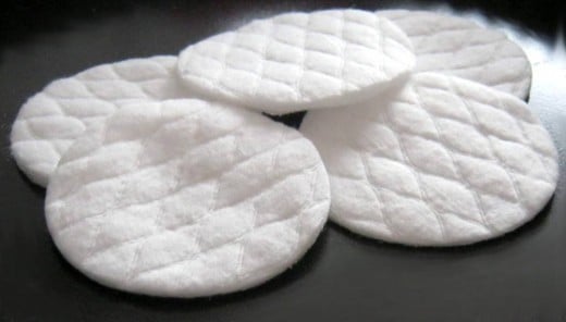 Cotton pads hygienically serve as disposable applicators and actually work better on problem skin than a brush or powder puff.