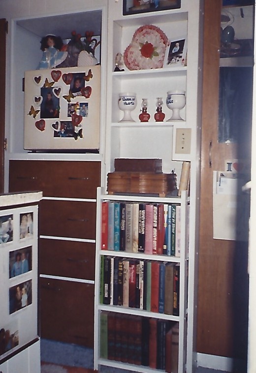 From the doorway.... I built an antique shelf into the race where I removed gas furnace.  Electric refrigerator is to the left above clothes drawers.  Bathroom door on right.
