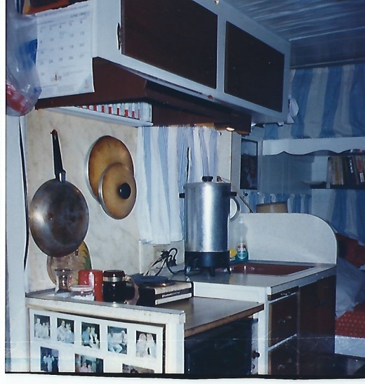 Kitchen before I put A/C in window or Microwave that sat where hot plate is.