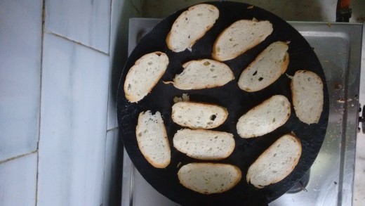 Garlic bread cut and placed on the griddle
