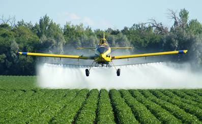 Crop dusting is like watching a master painter at work