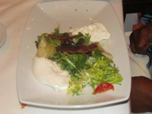 A exquisite salad with various chesses.