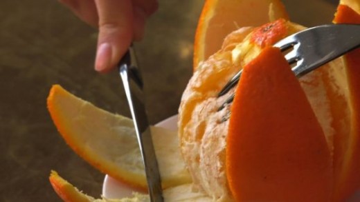 One must be able to peel one's orange without using one's fingers.