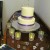 The vanilla iced cake was decorated with purple ribbons and candles that surrounded it. The vanilla iced cake was decorated with purple ribbons and candles that surrounded it.
