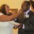 The bride and groom shared cake with each other after they cut it together. The bride and groom shared cake with each other after they cut it together.