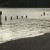 Picnic tables, ramp and grassy knoll buried by water.