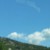 Mountainous are surrounded by white puffy clouds while we were in Nice, France.