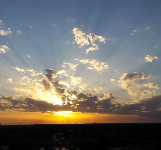 white clouds amid sunshine's splendor...