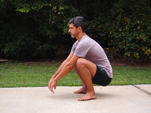 A man performing a full squat