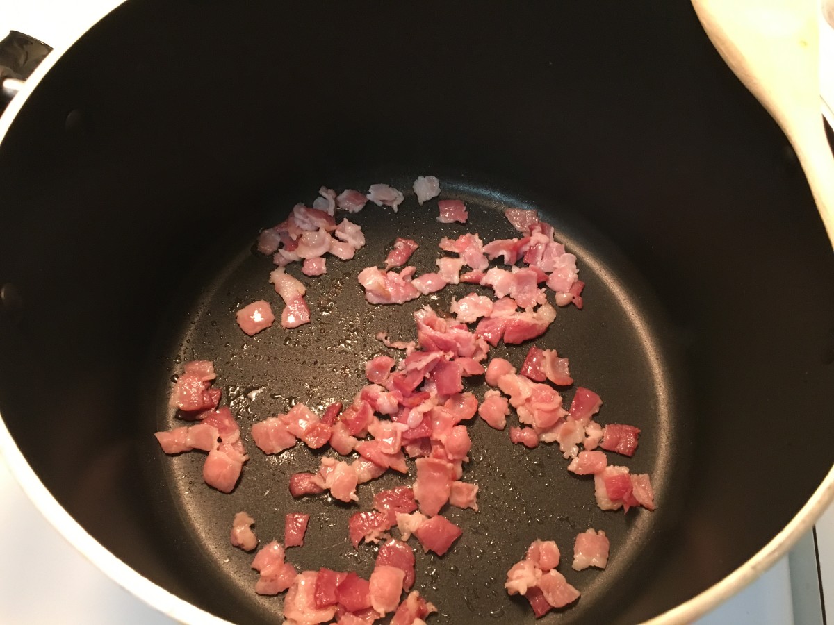 The bacon cooks first. The smaller the pieces the greater the surface area. The more surface area the faster it will cook.