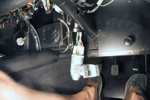 On some models, you can access the switch after dropping the steering column.