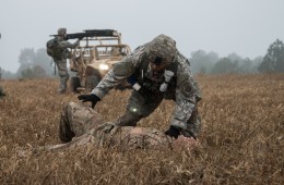 A medical soldier treating casualties in training scenario, 2016.
