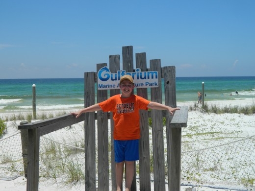 Caleb on the huge chair at the Gulfarium