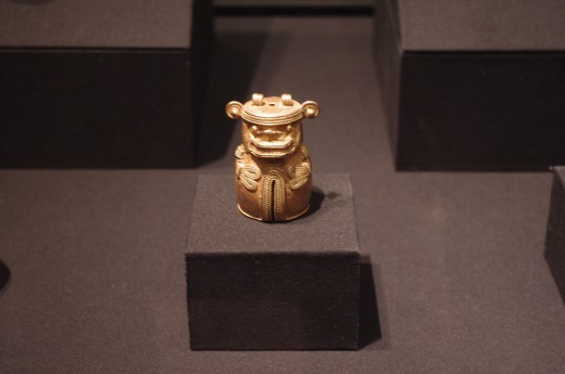 "Bell with Feline Deity" Tairona (Late Intermediate Period, 900-1500 CE). Made of gold. Most likely a dinner bell if my research is correct. Just kidding, I don't really know. :)
