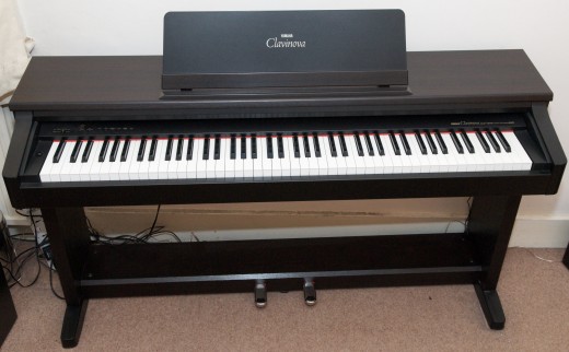 Practice on a digital piano like this rather than on an electronic keyboard. 