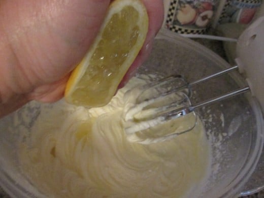 Squeezing in the lemon juice