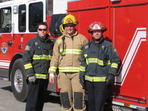 Former 2011 first round draft pick Danny Watkins (center) is now a firefighter in Dallas 