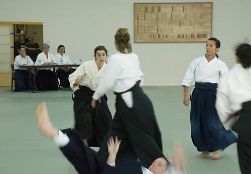These women are demonstrating the Aikido technique of randori (multiple attackers).  Control of breathing helps maintain a calm mind.