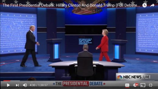 DJT is first to present a hand for the handshake; his palm is open.  HRC has not yet lifted her right hand.  HRC is the first to pass her podium and has moved closer to DJT's side of the stage.