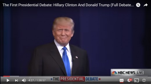 DJT is now captured by the television camera for the first time, looking toward the audience with a smile. HRC is not in this frame.