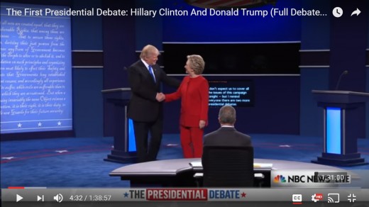 DJT moves HRC's hand in additional shakes.  DJT's head is inclined toward HRC.  HRC's head faces DJT with no incline. Distance is lessened and HRC's left arm is now closer. 