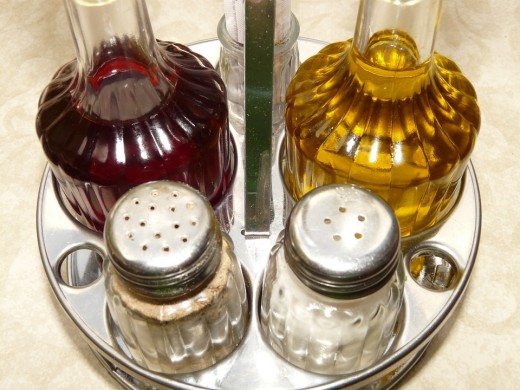 Salt and pepper can be put either by following the salt and pepper rule using numbers of holes or not but you should strictly follow it when putting it on tables inside your restaurants.