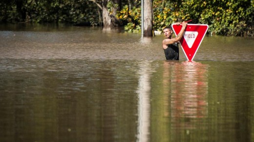 Man holds on for dear life to a Yield sign in South Carolina