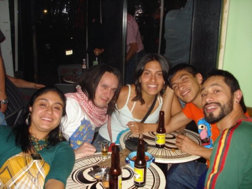 Friends enjoying mezcal.  Bloke second from left looks like he's swallowed the worm!