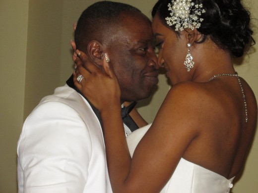 Darlena and Raymond, embrace during their wedding ceremony. 