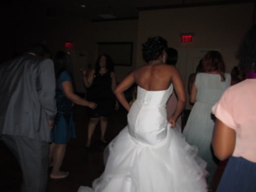 Darlena, dances in her beautiful gown with family and friends at her reception.