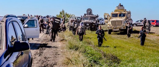 Police Advance on Native Americans Praying