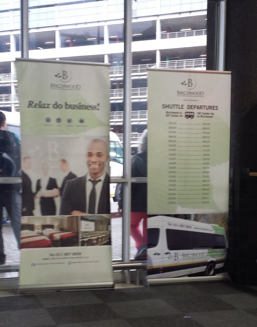Signs for hotels like this Birchwood Hotel were posted within the bus terminal. Along with its pick up times,