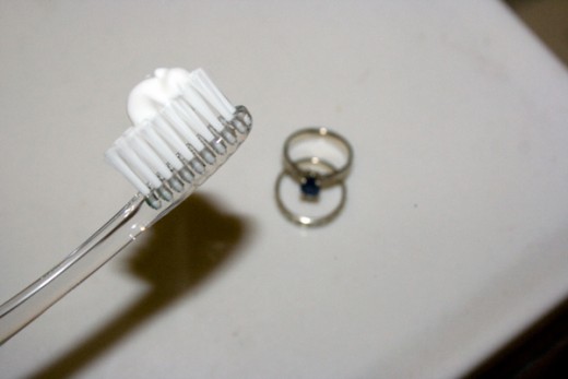Toothpaste is good for your teeth, and may be just the thing your gold piece needs.