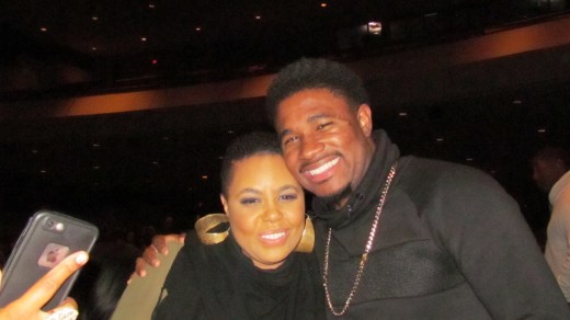 Carol Riddick, takes a quick photo with her son. Carol, is one of the most talented women in the music industry at this present time. 