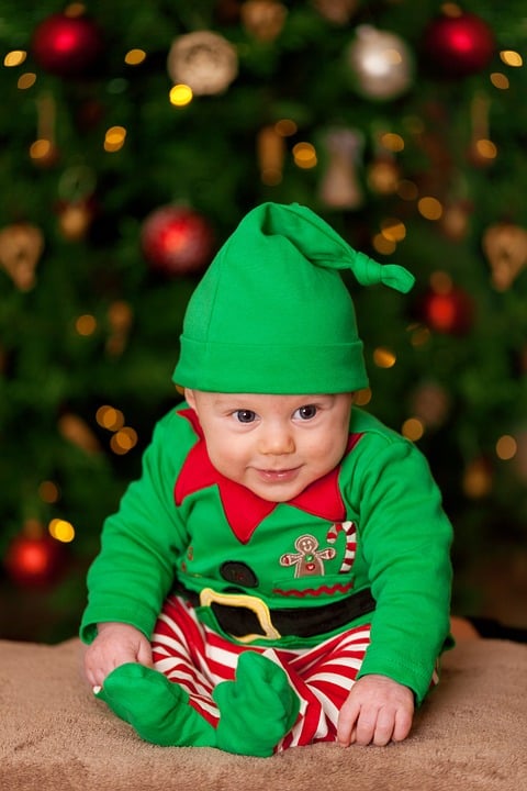 Here's an adorable elf costume for a baby...see the collar and the striped tights? They make the costume.